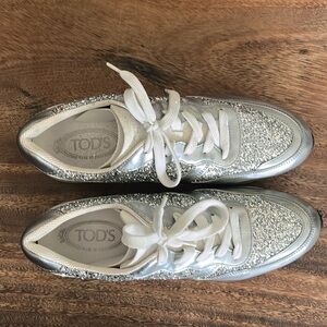 Tod’s metallic silver glitter lace up sneakers